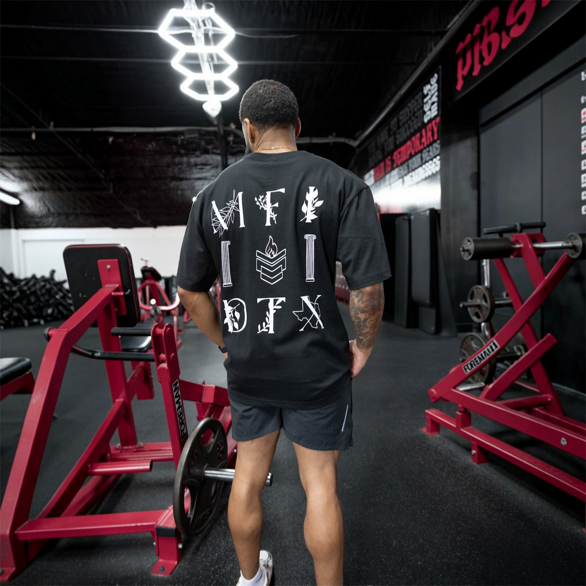 Manifest apparel worn on the gym floor, viewed from behind